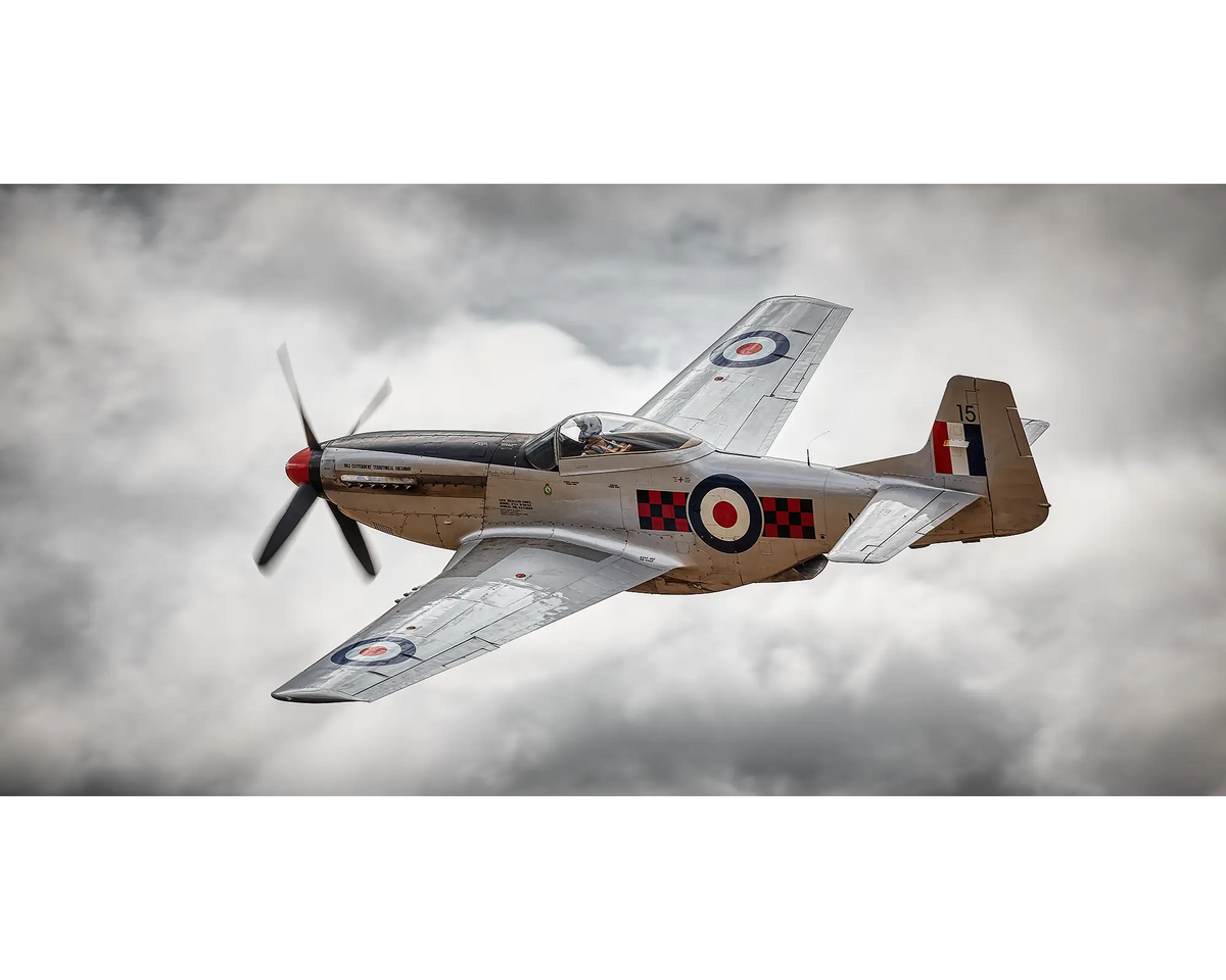 P-51 Mustang painted in Royal New Zealand Air Force colours flying through clouds.