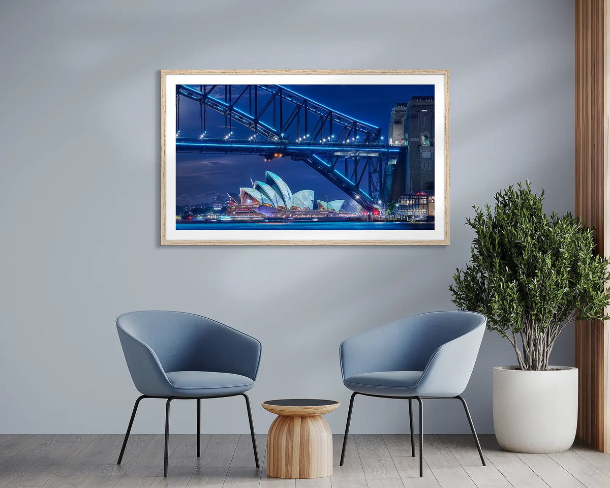 Neon. Sydney framed wall art print, with an Oak frame, in a meeting room. 