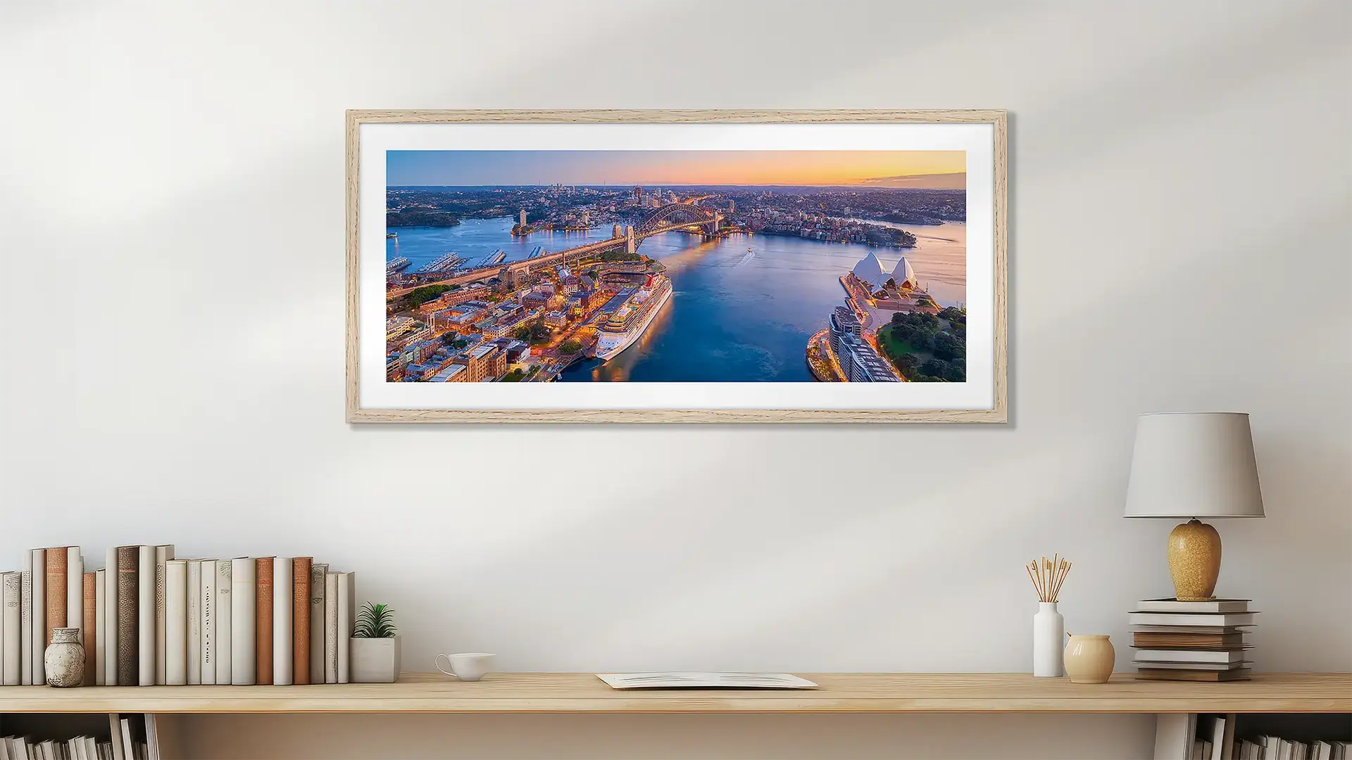 New South Wales wall art print with timber frame hung above bookshelf.