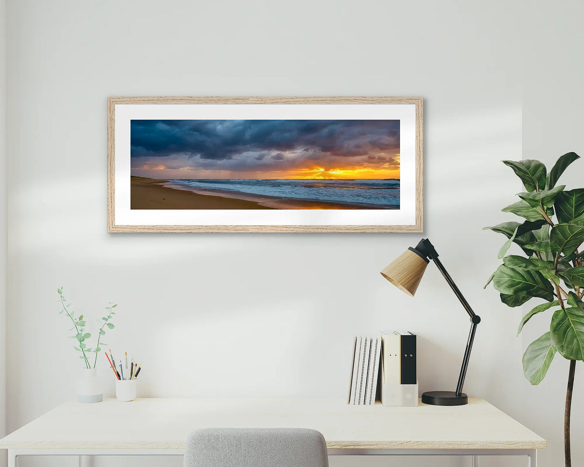 Newcastle Awakening. Framed coastal wall art print, in an Oak frame, of Nobbys beach at sunrise. 