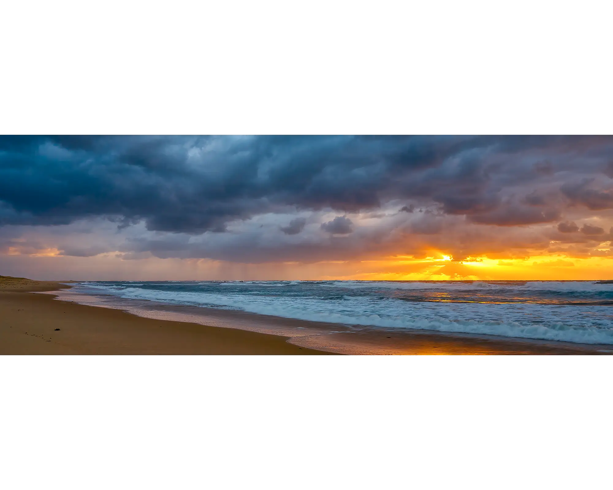 Stormy sunrise at Nobbys Beach, Newcastle, NSW.