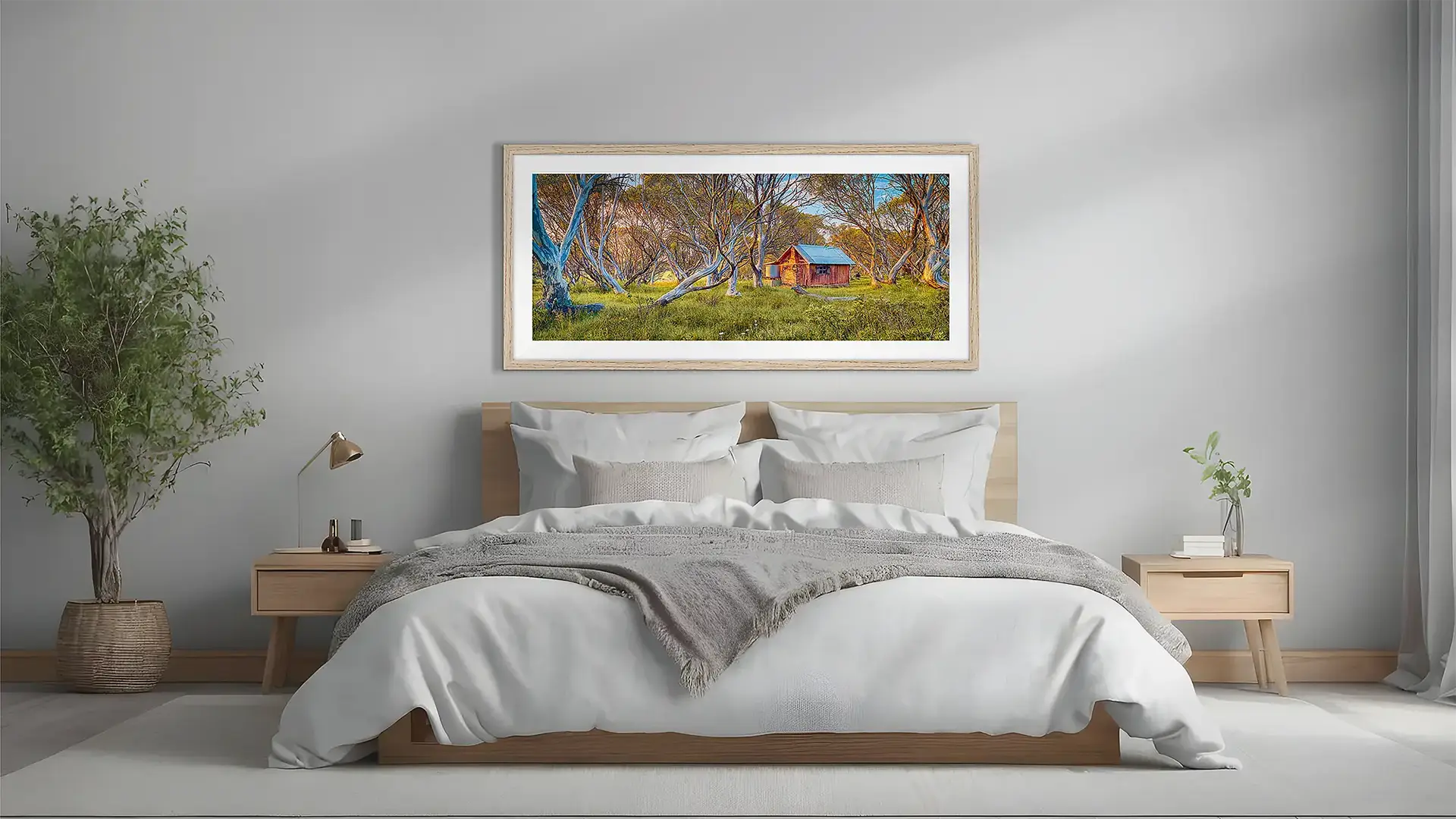 North East Victoria wall art framed in tasmanian oak frame above a bed.