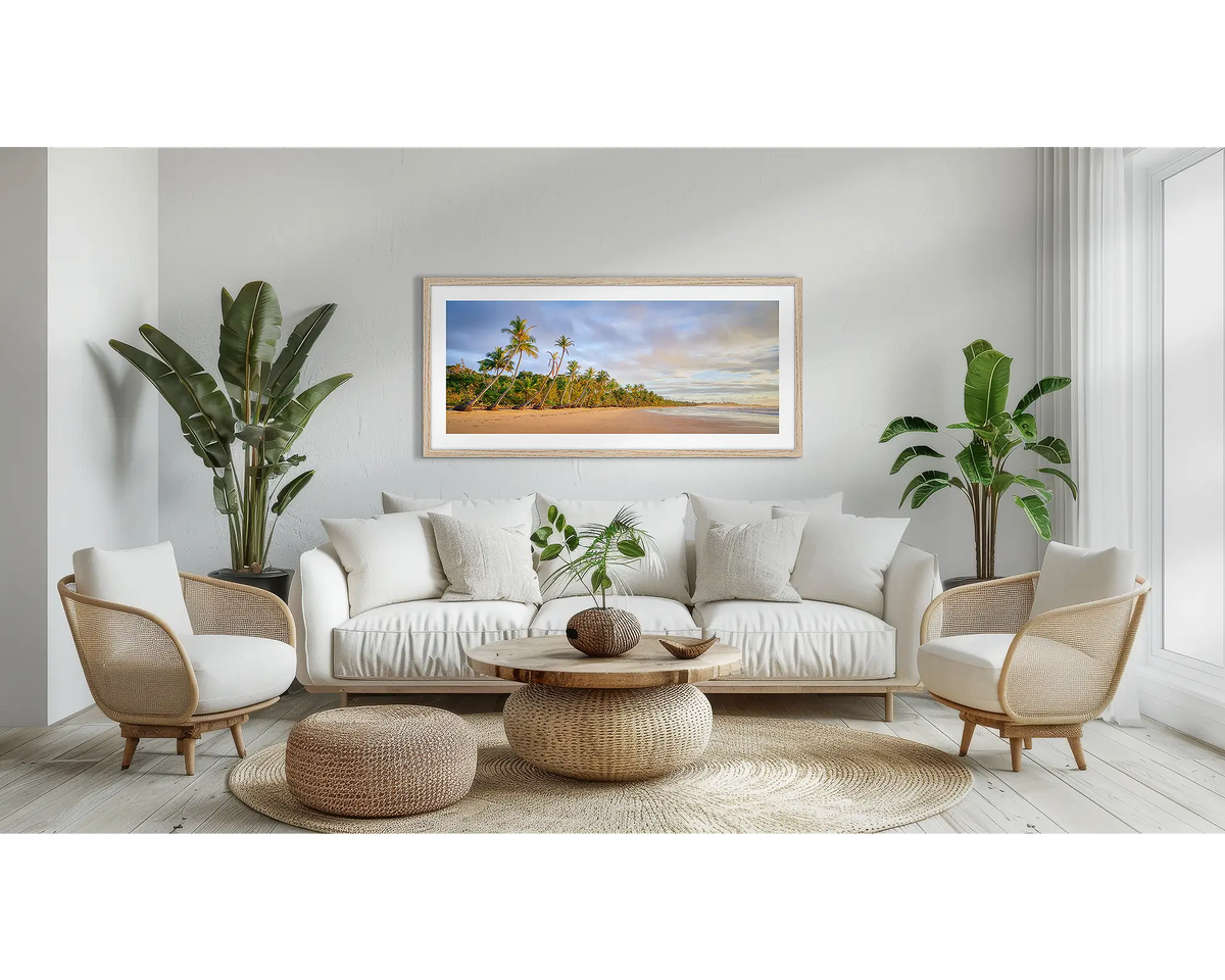 Ocean Breeze. Coastal Queensland wall art print, with a Tassie oak frame, above a couch. 