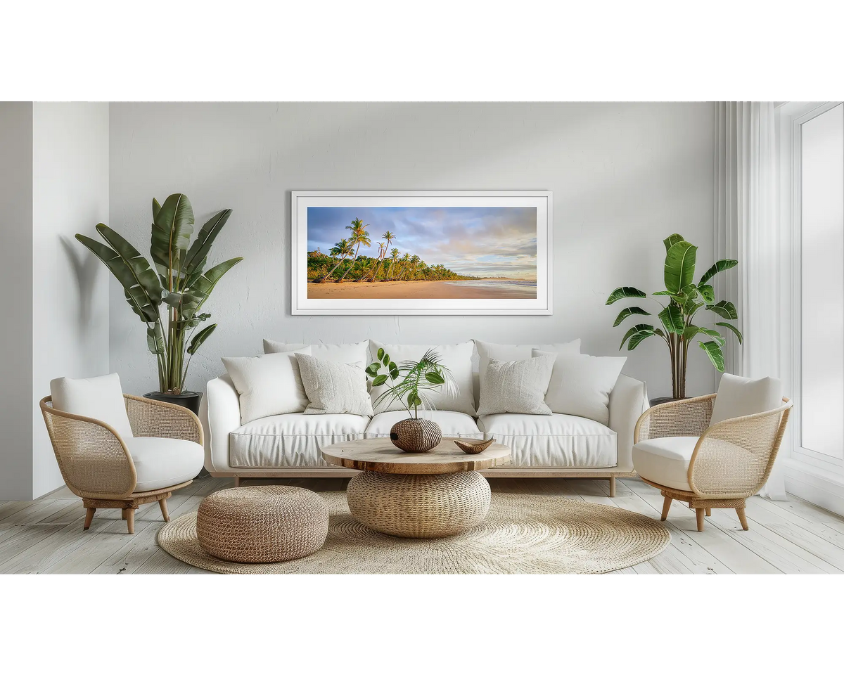 Ocean Breeze. Coastal Queensland wall art print, with a white frame, above a couch. 