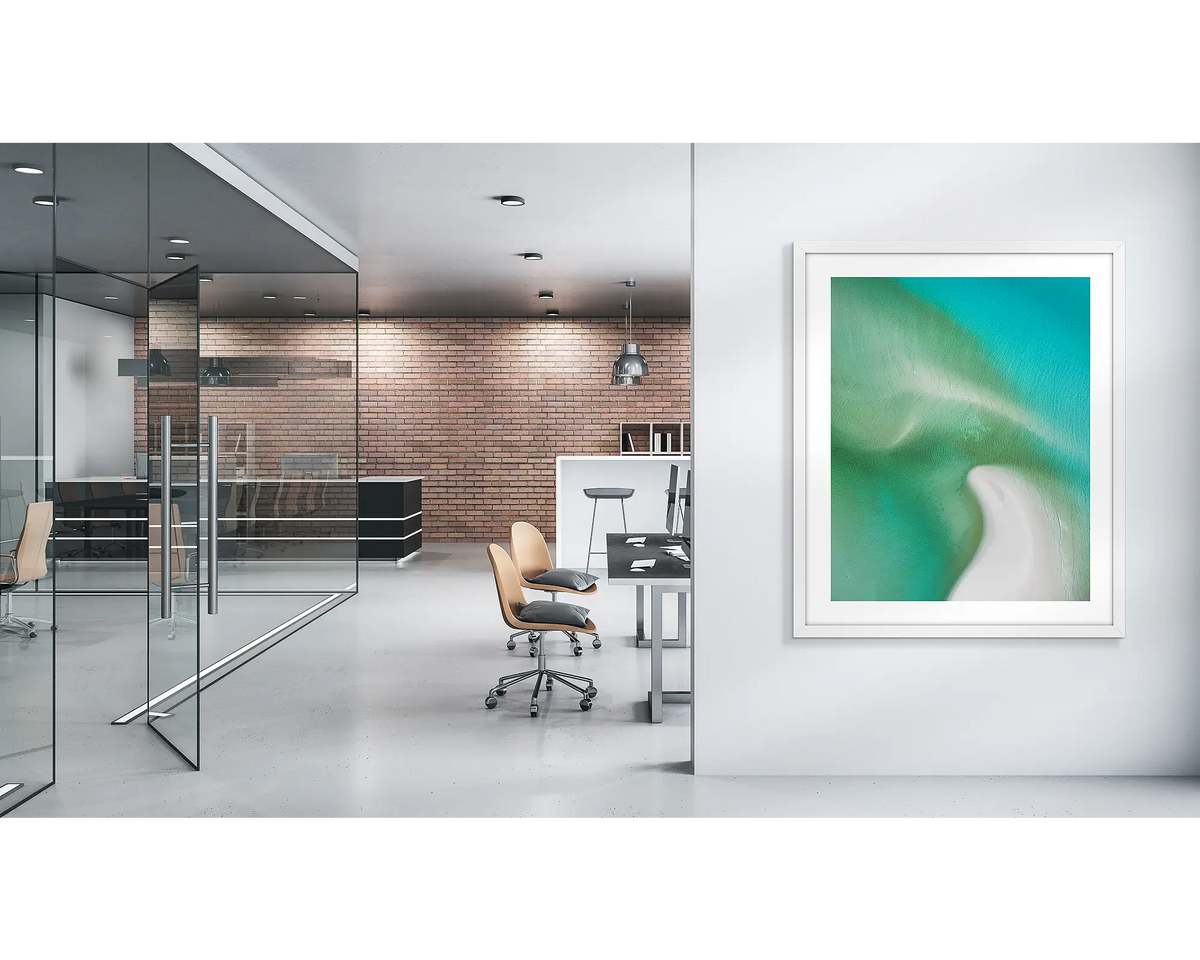 Opal Illusion. Whitsunday wall art print with a white frame, in a modern office. 