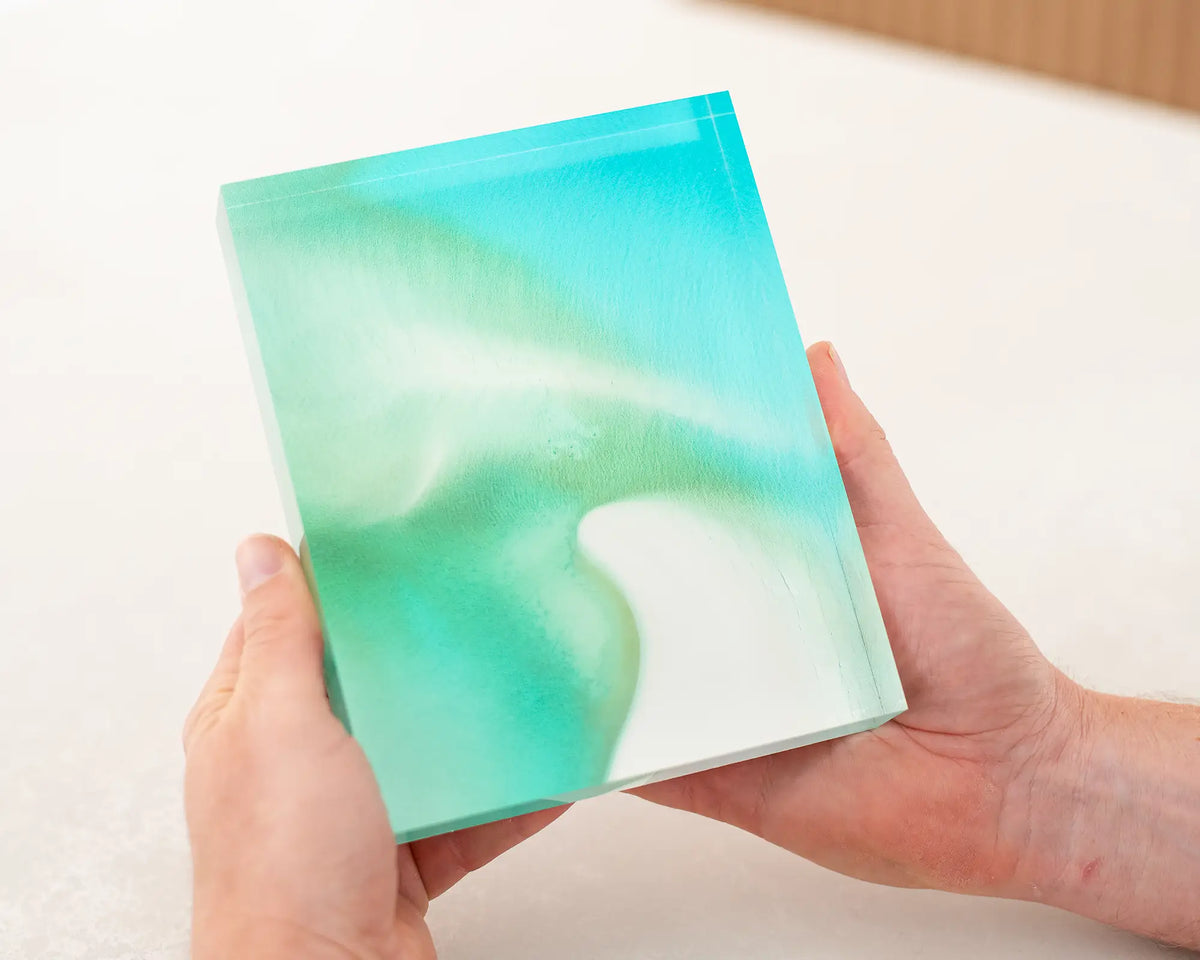 Opal Waters acrylic block being held.