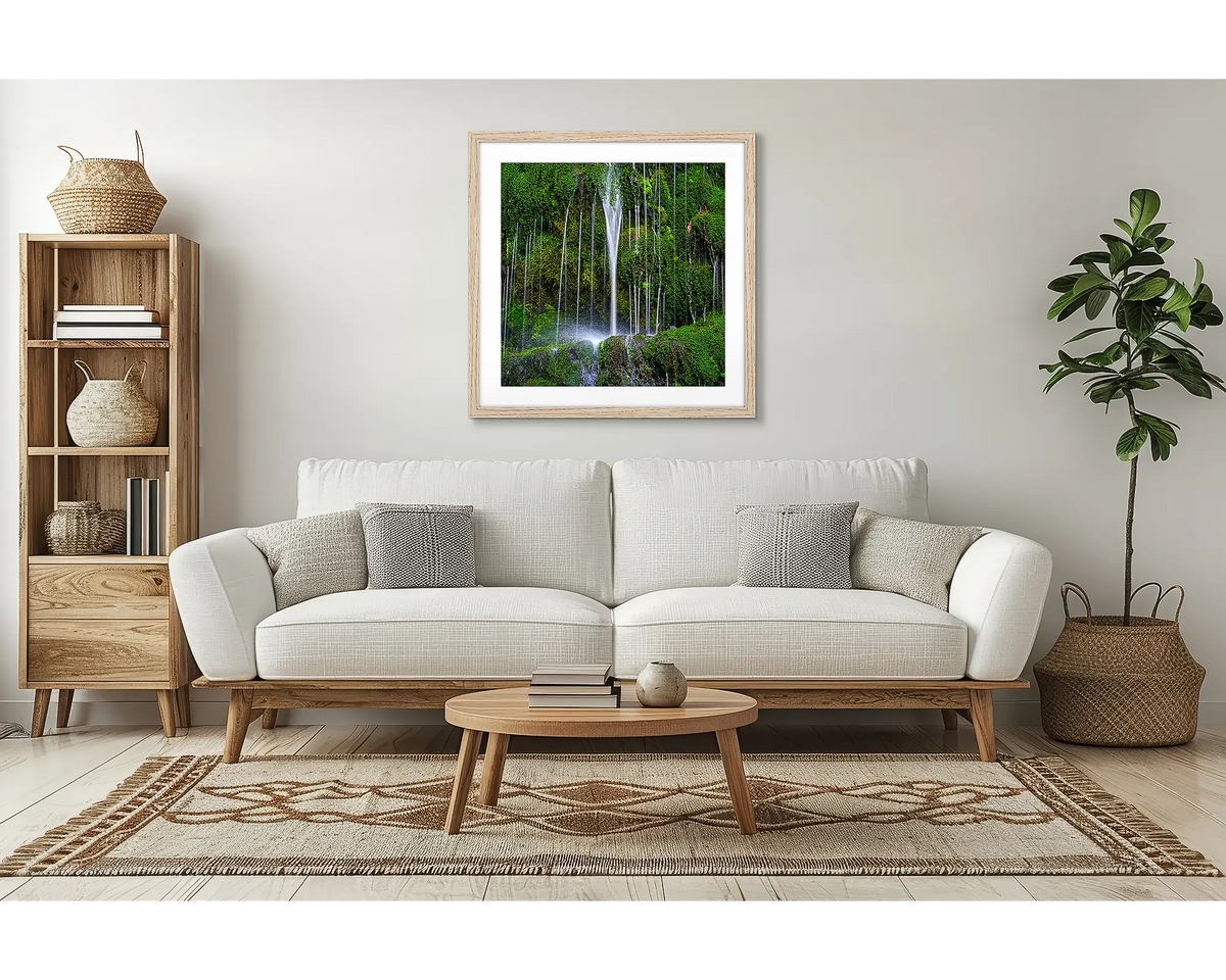 Otway Flow. Waterfall wall art with a timber frame, in a lounge room, above a couch. 