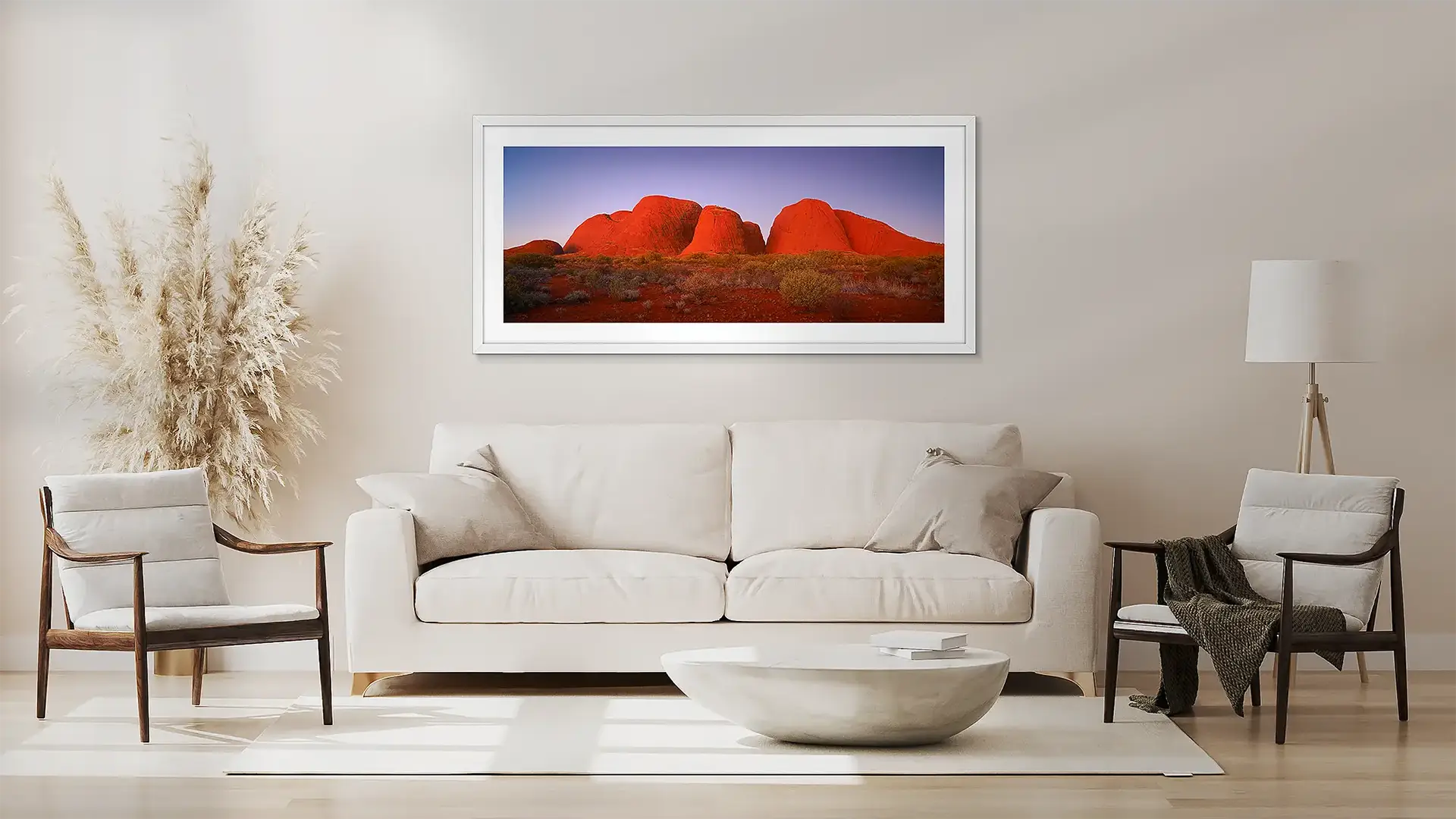 Outback wall art in white frame above couch