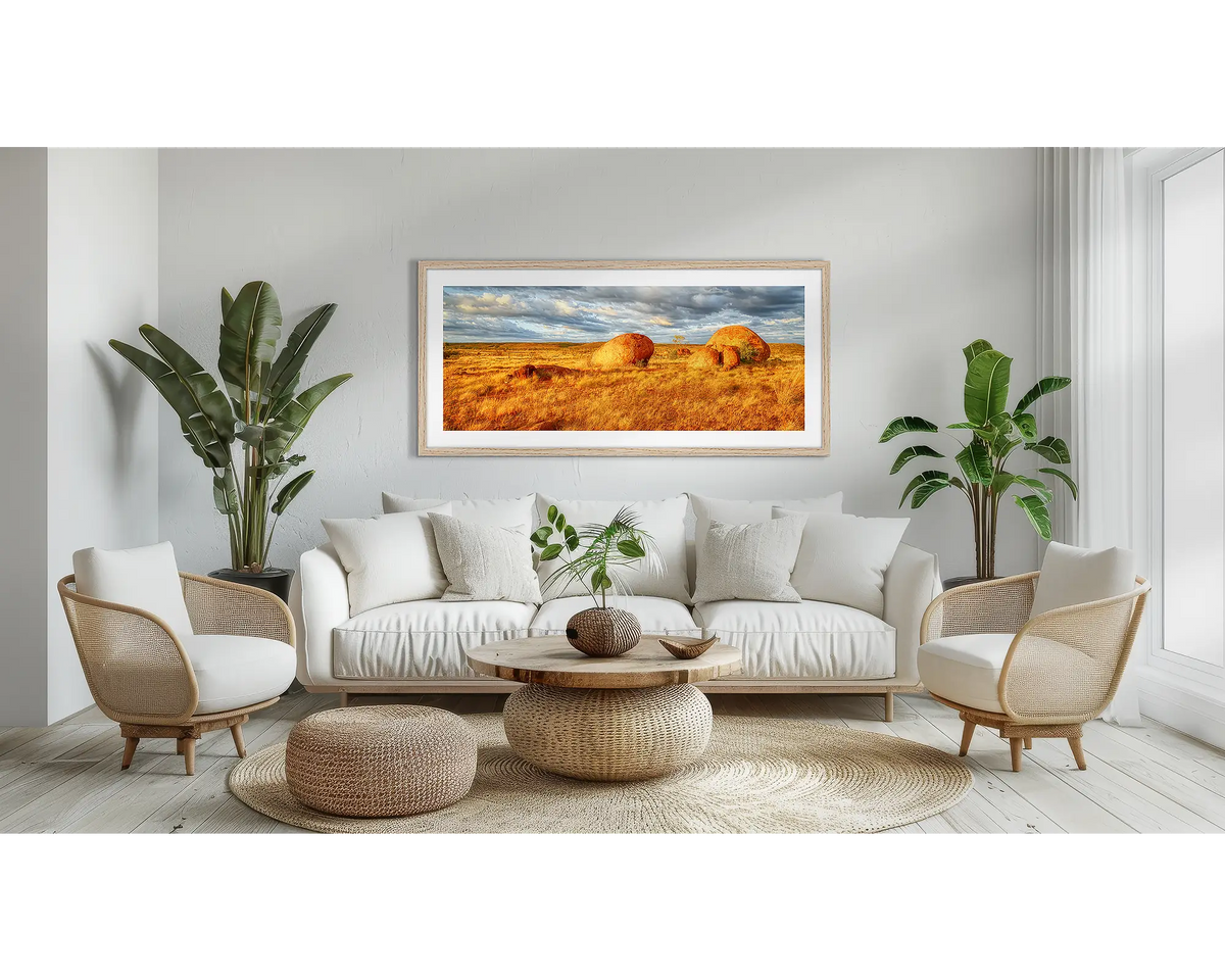 Outcrop. Devils Marbles wall art in a Tasmanian Oak frame, hanging in a lounge room.