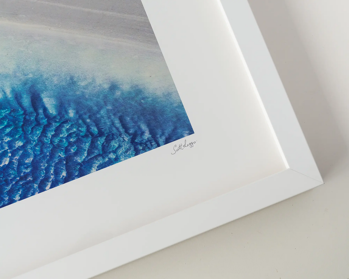 Outlet. Blue water and white sand at Roebuck bay in west Kimberley, Western Australia. Wall art in a white frame.