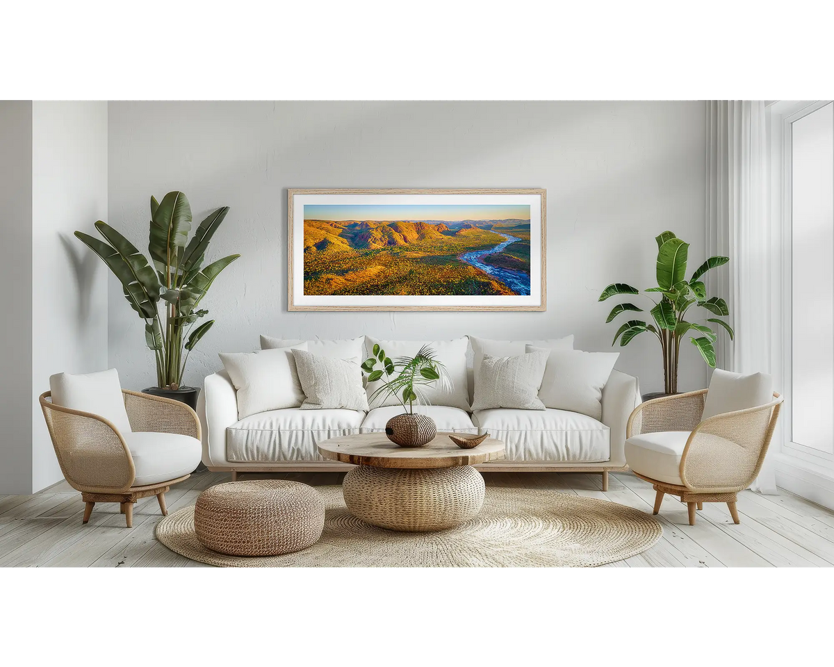 Overflow. Kimberley wall art print with a Tassie Oak frame above a couch.