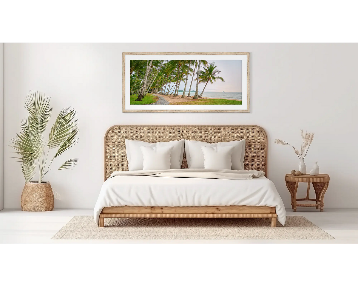 Palm Tree Tunnel. Palm Cove wall art print, in an oak frame, in a bedroom. 