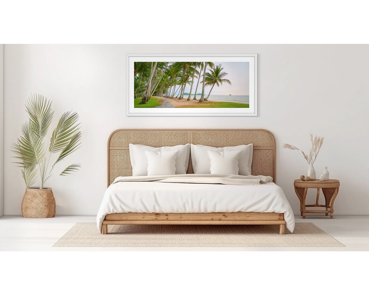 Palm Tree Tunnel. Palm Cove wall art print, in a white frame, in a bedroom. 