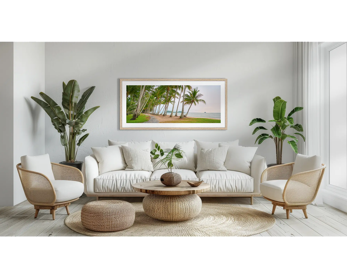 Palm Tree Tunnel. Queensland wall art print, with a Tassie oak frame, above a couch.