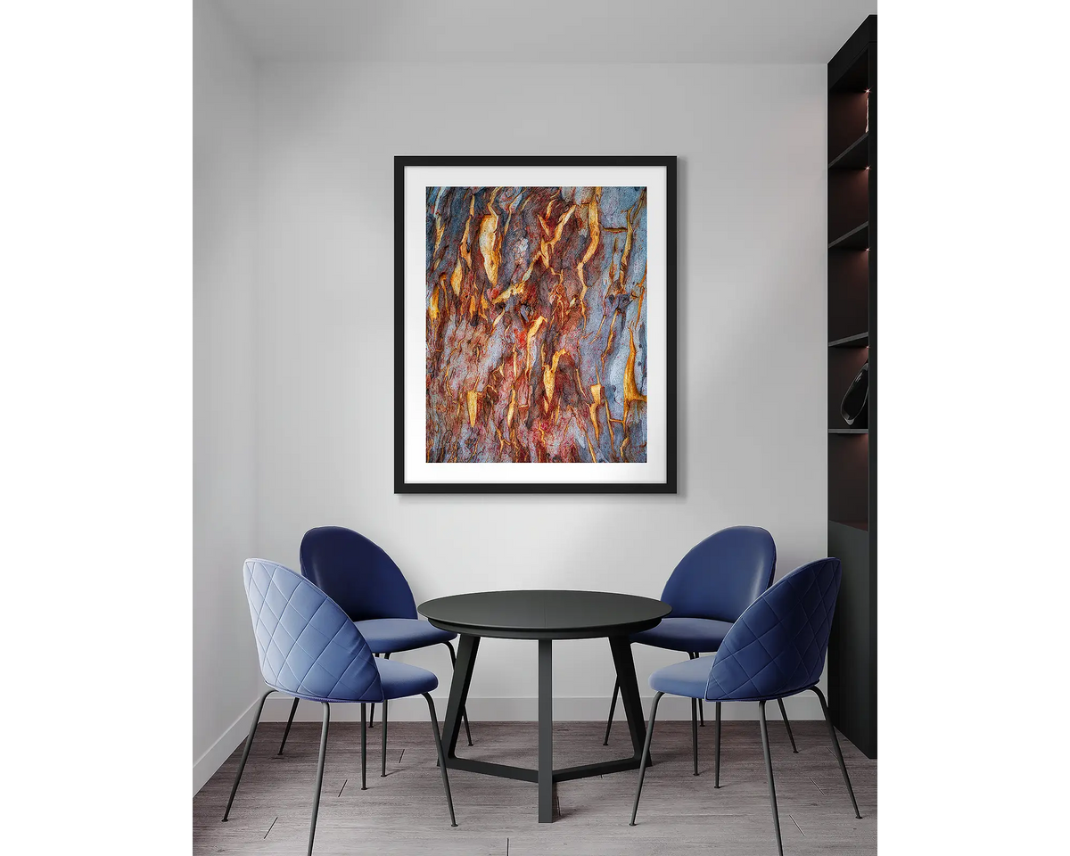 Peeling. Gum tree bark abstract wall art print, with a black frame, in an office meeting room. 