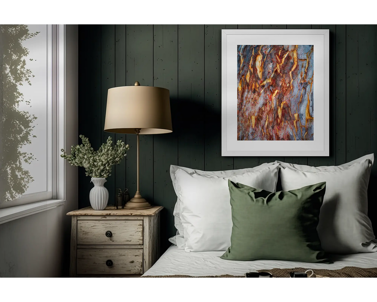 Peeling. Gum tree bark framed wall art print, in a white frame, hanging on a bedroom wall.