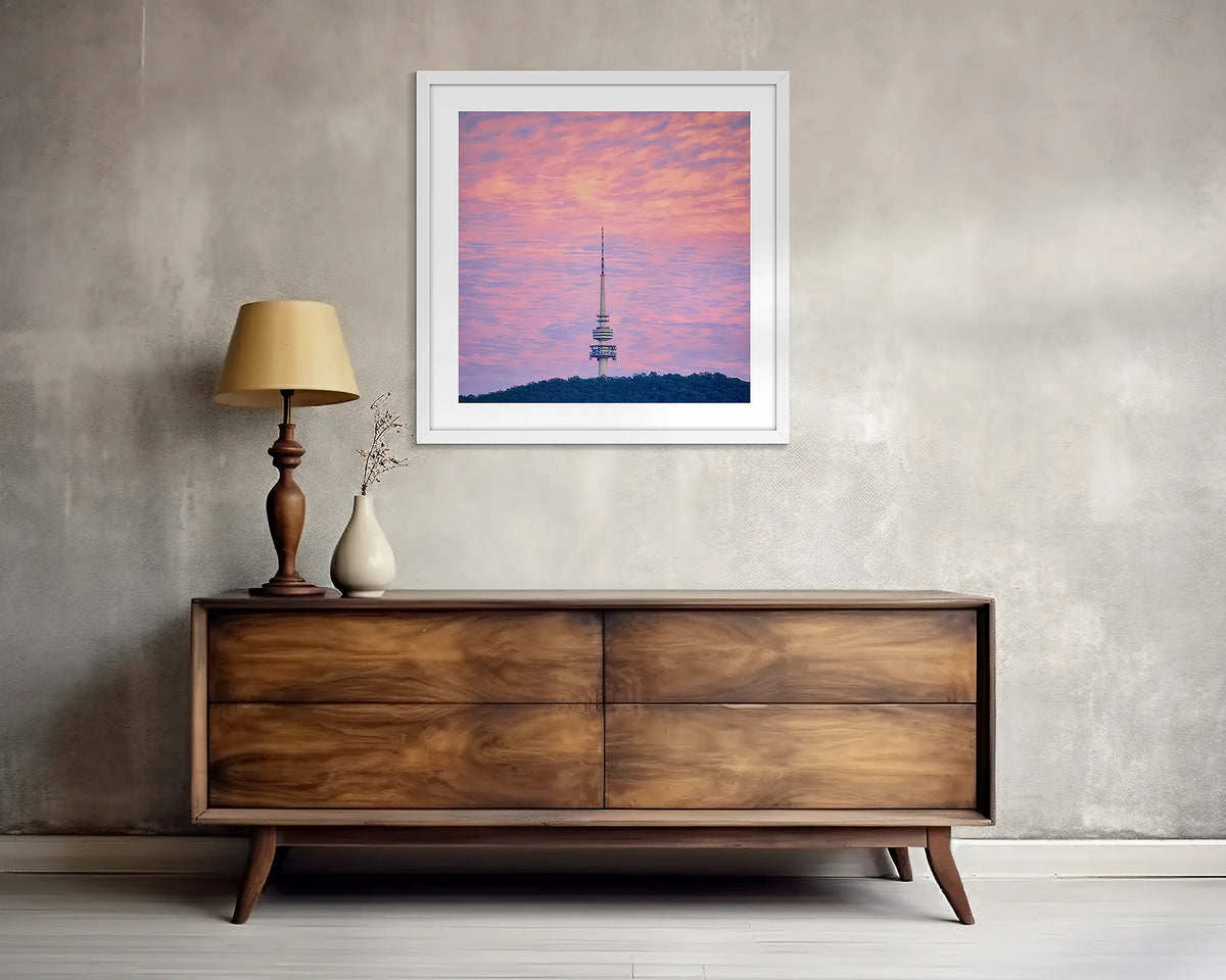 Pointer. Square, Canberra wall art print, with a white frame, above a side table. 