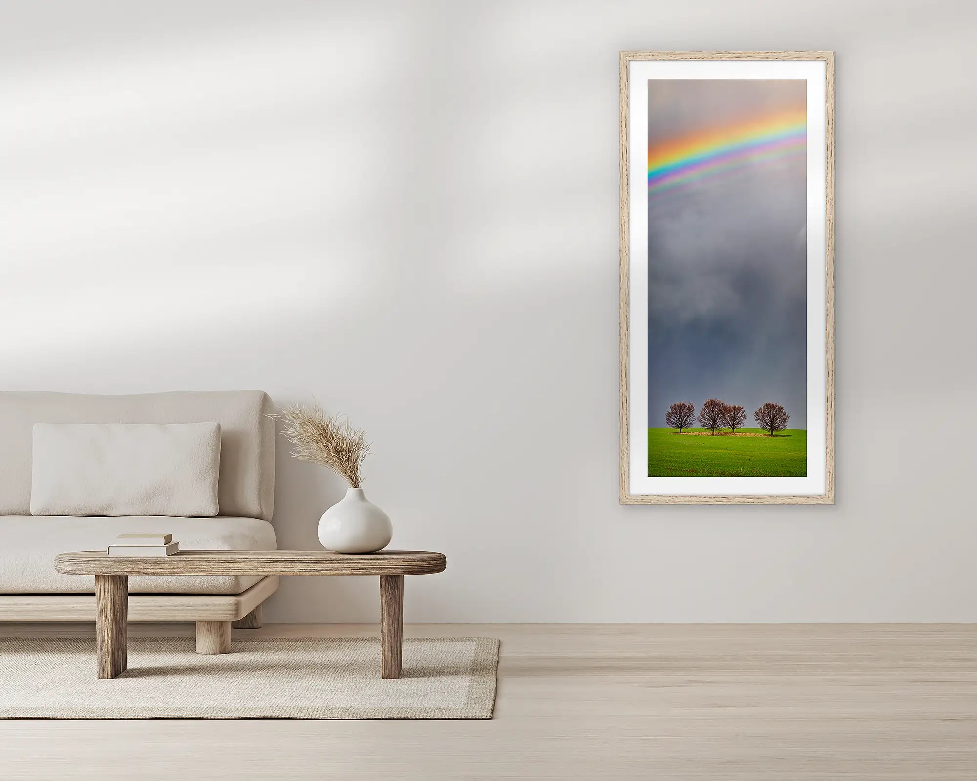 Rainbow over the farm with trees in paddock.