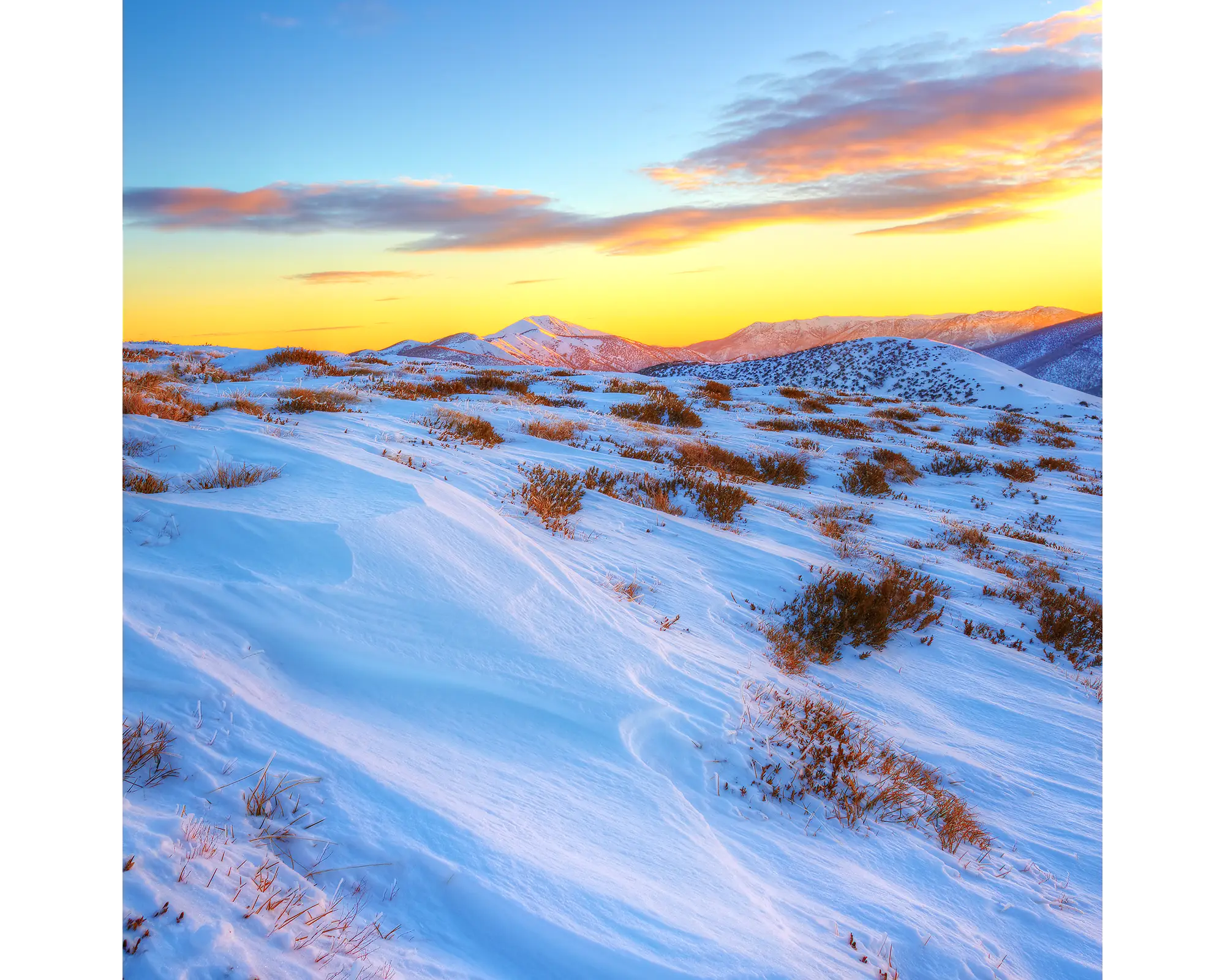 Sunrise over Razorback Ridge leading to Mount Feathertop, Alpine National Park, Victoria. 