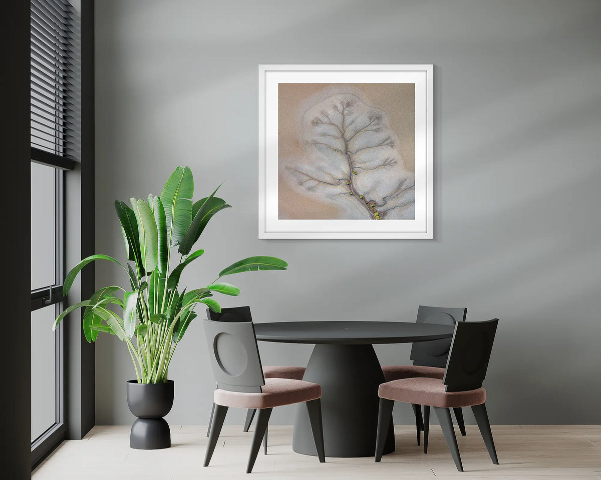 Reach Out. Abstract Kimberley artwork, with a white frame, hung in an office meeting room. 