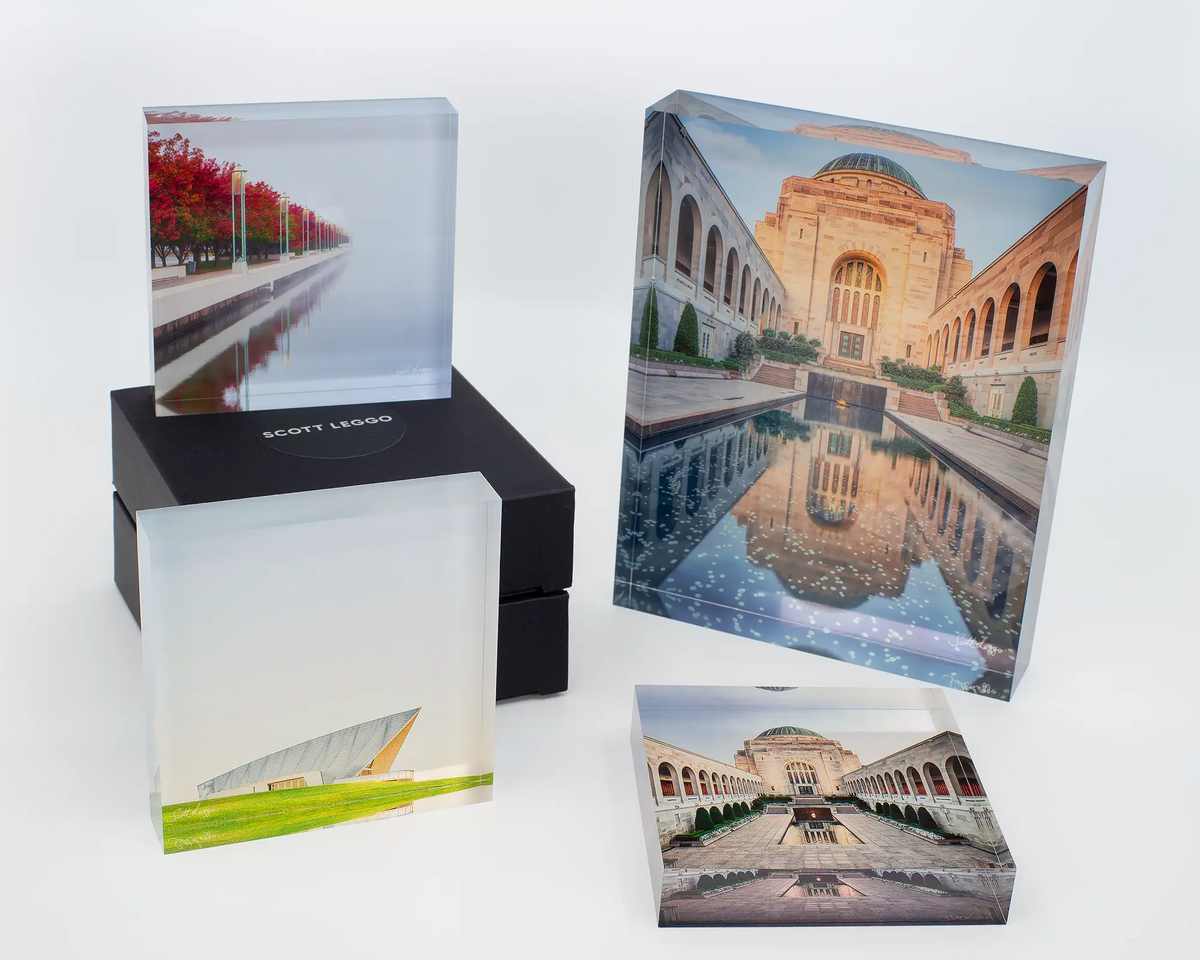 Red Serenity acrylic block displayed with other Canberra themed acrylic blocks. 