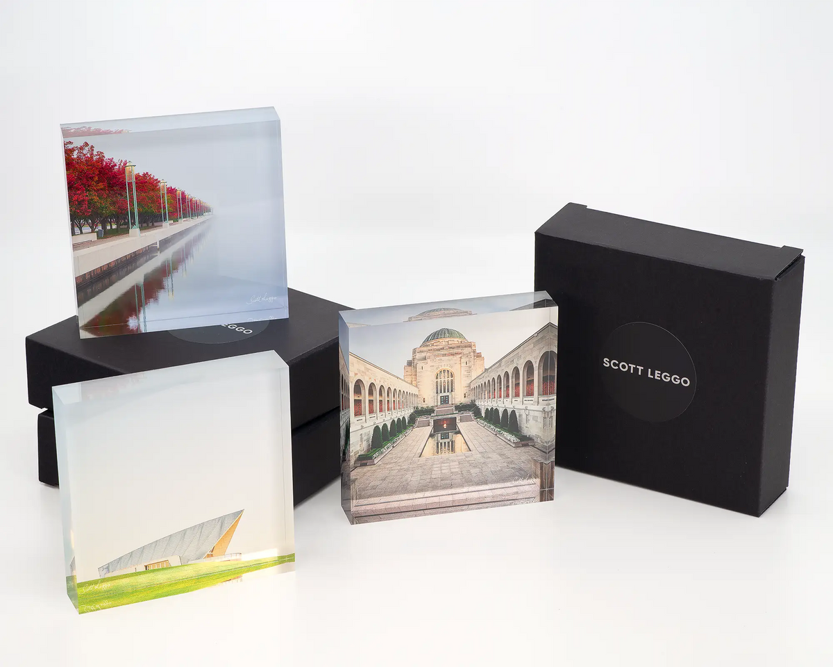 Red Serenity acrylic block displayed with other Canberra themed acrylic blocks. 