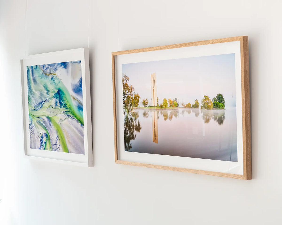 Reflective. Carillion in early morning fog. Canberra wall art in Tasmanian oak frame hanging in a gallery.