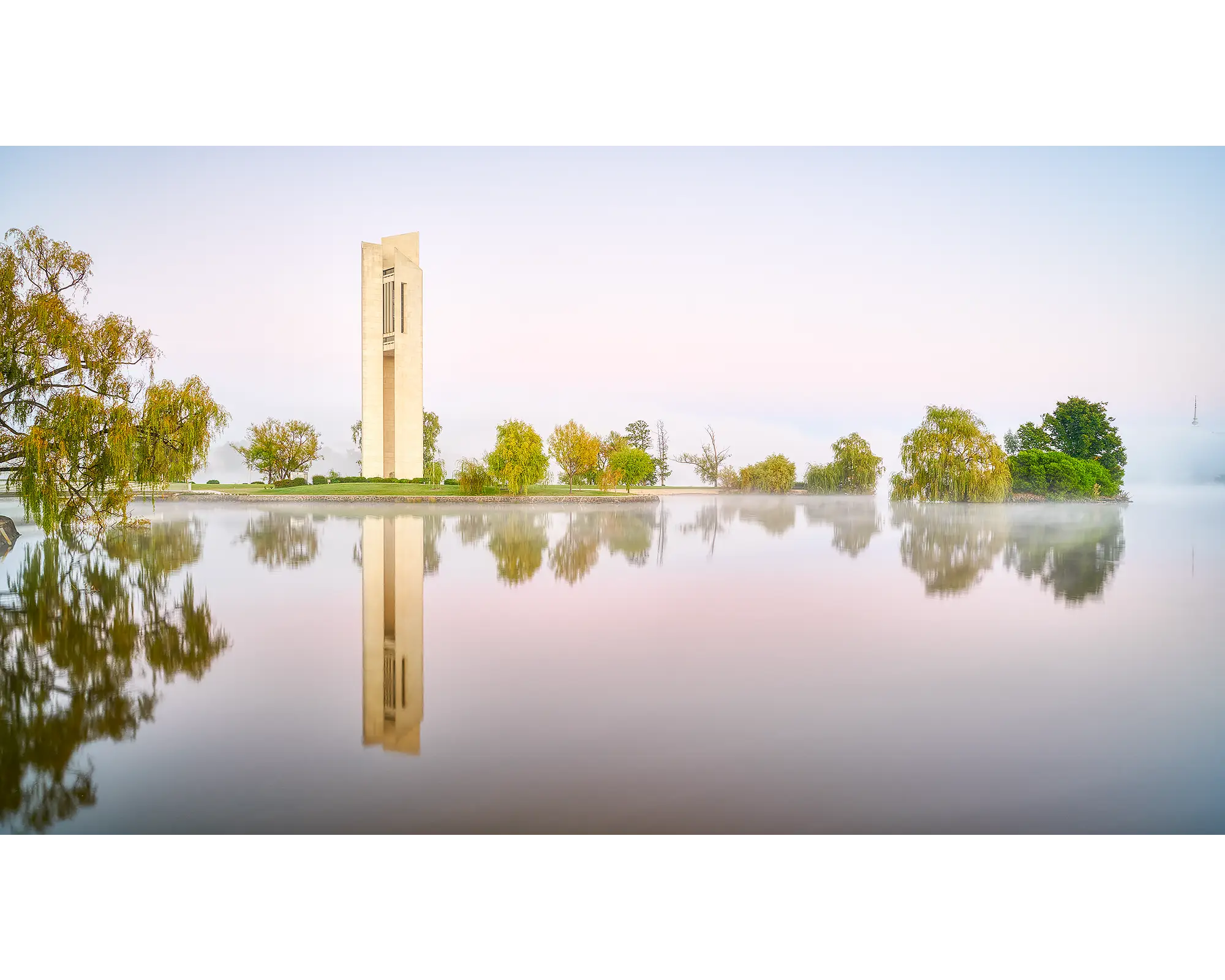 National Carillon surrounded by fog with reflections in Lake Burley Griffin below, Canberra, ACT. 