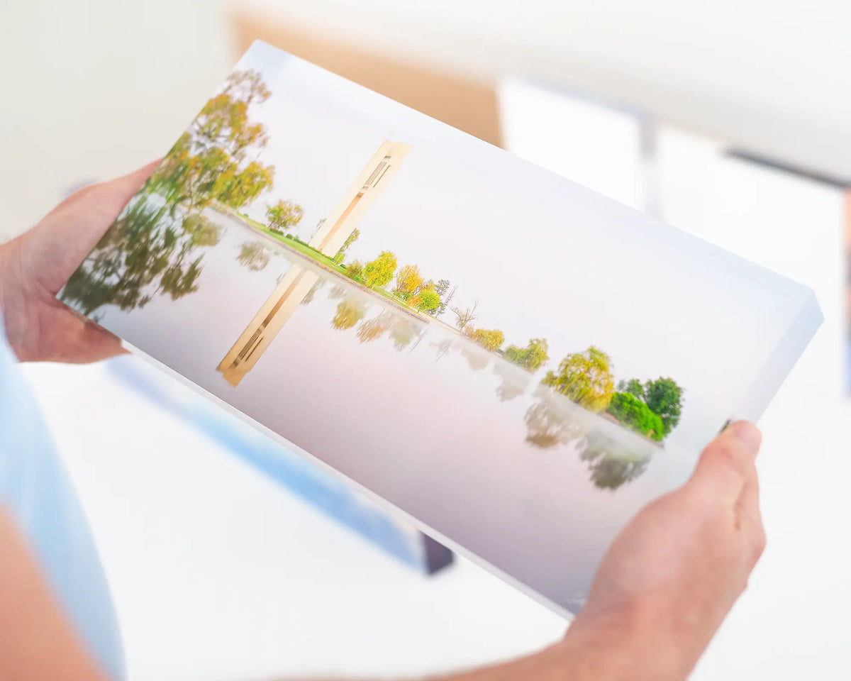 Reflective acrylic block being held. 