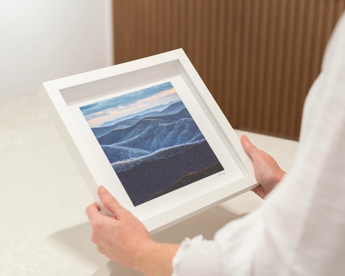 Rise and Fall. Mountain range small framed print with a white frame.