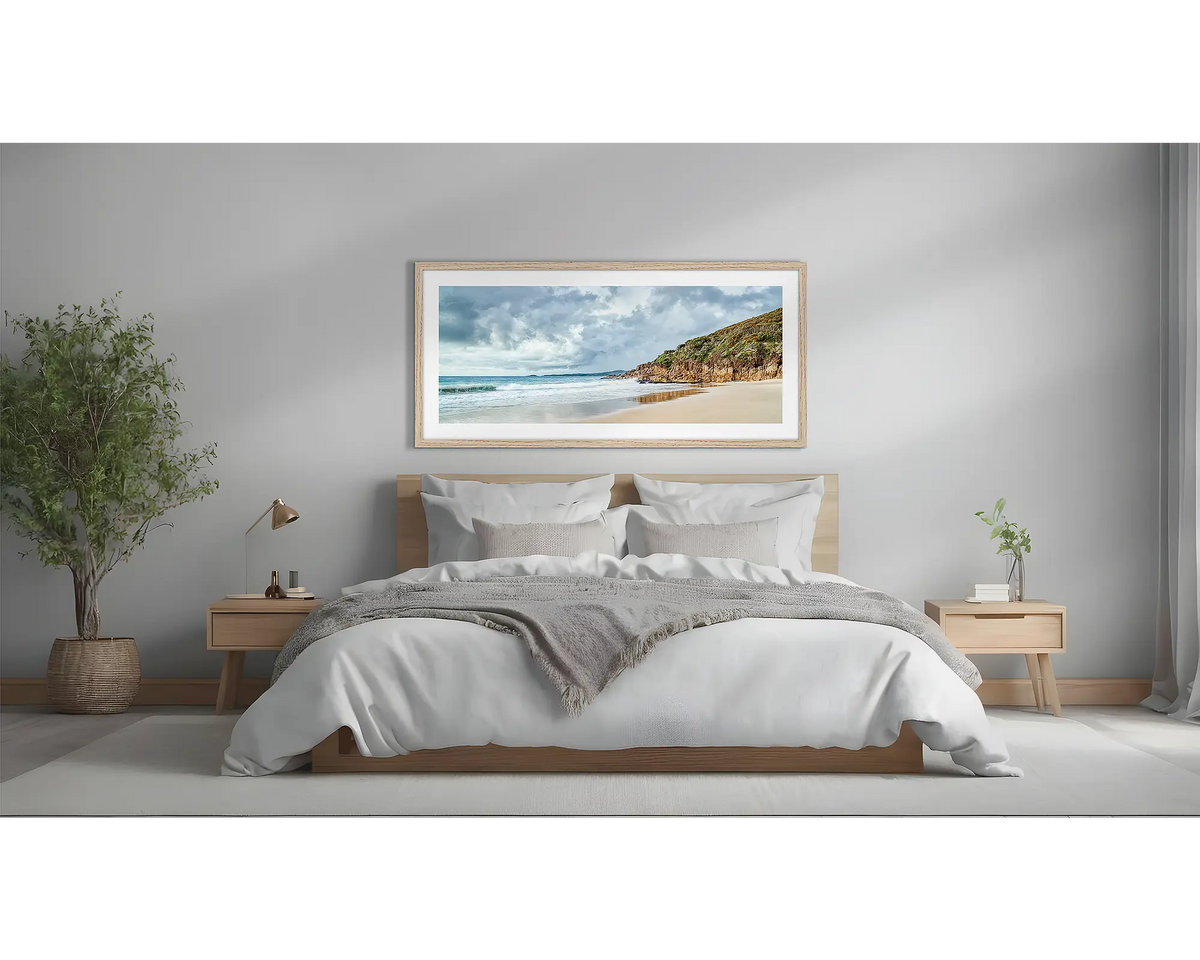 Rolling In. Coastal wall art framed in a Tasmanian oak frame, hanging above a bed. 