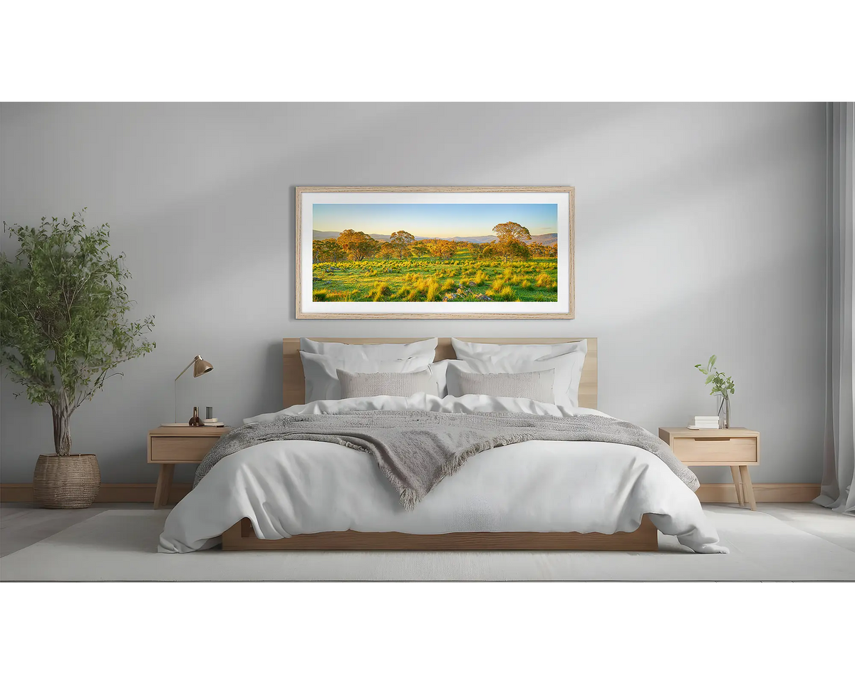 Rural Tranquility. Rural wall art with a Tasmanian Oak frame above a bed. 