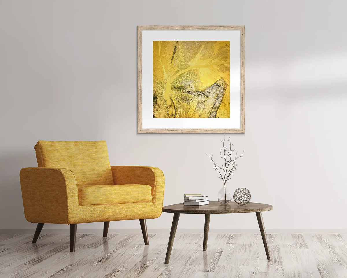 Sand Mining. Abstract wall art in Tasmanian Oak frame, hanging above a chair.