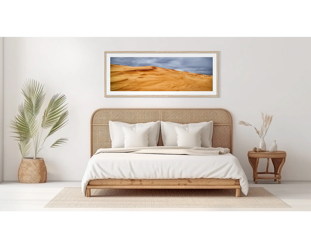 Sands of Time. Coastal artwork, in a wood frame, on a bedroom wall. 