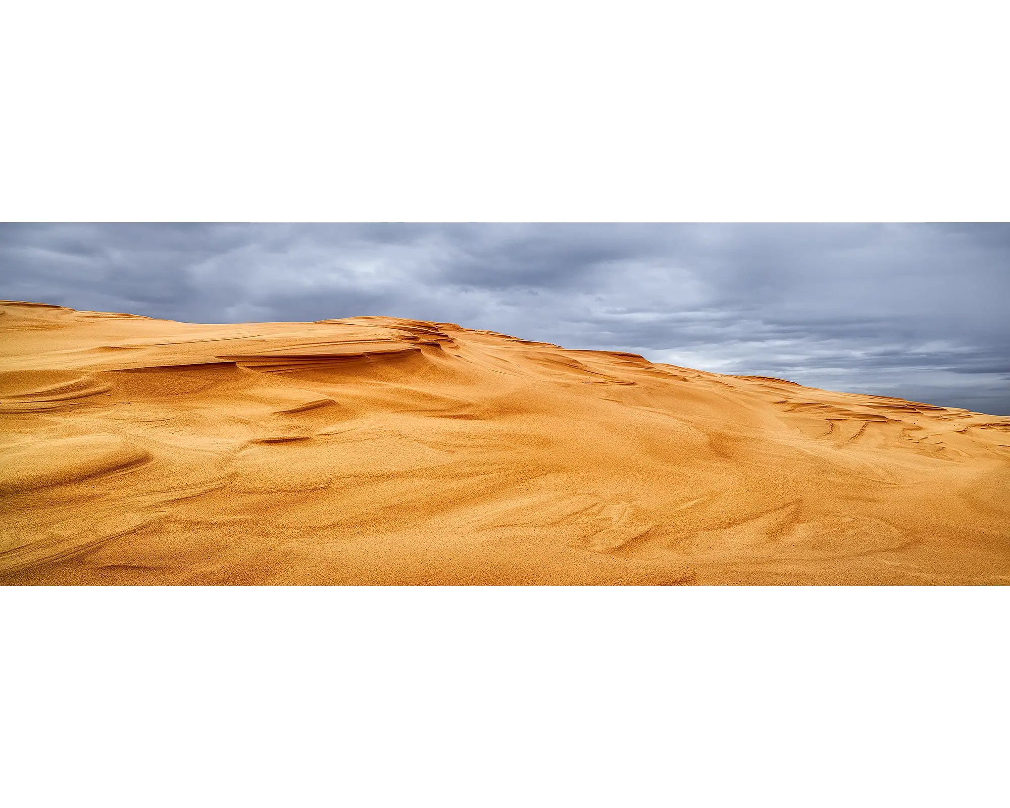 Storm clouds over sand dunes at Stockton Beach, NSW. 