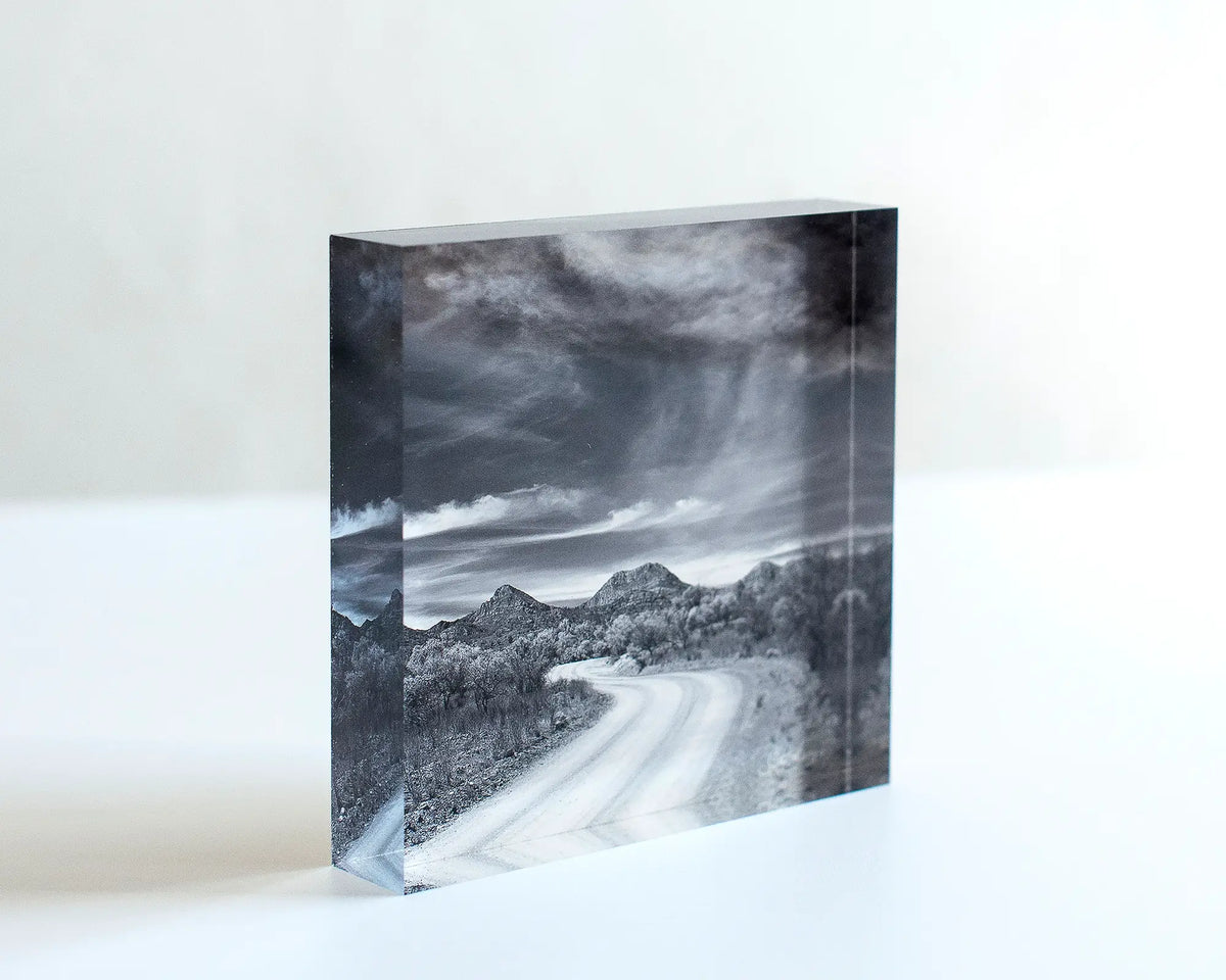 Scenic Drive acrylic block displayed standing on a desk. 