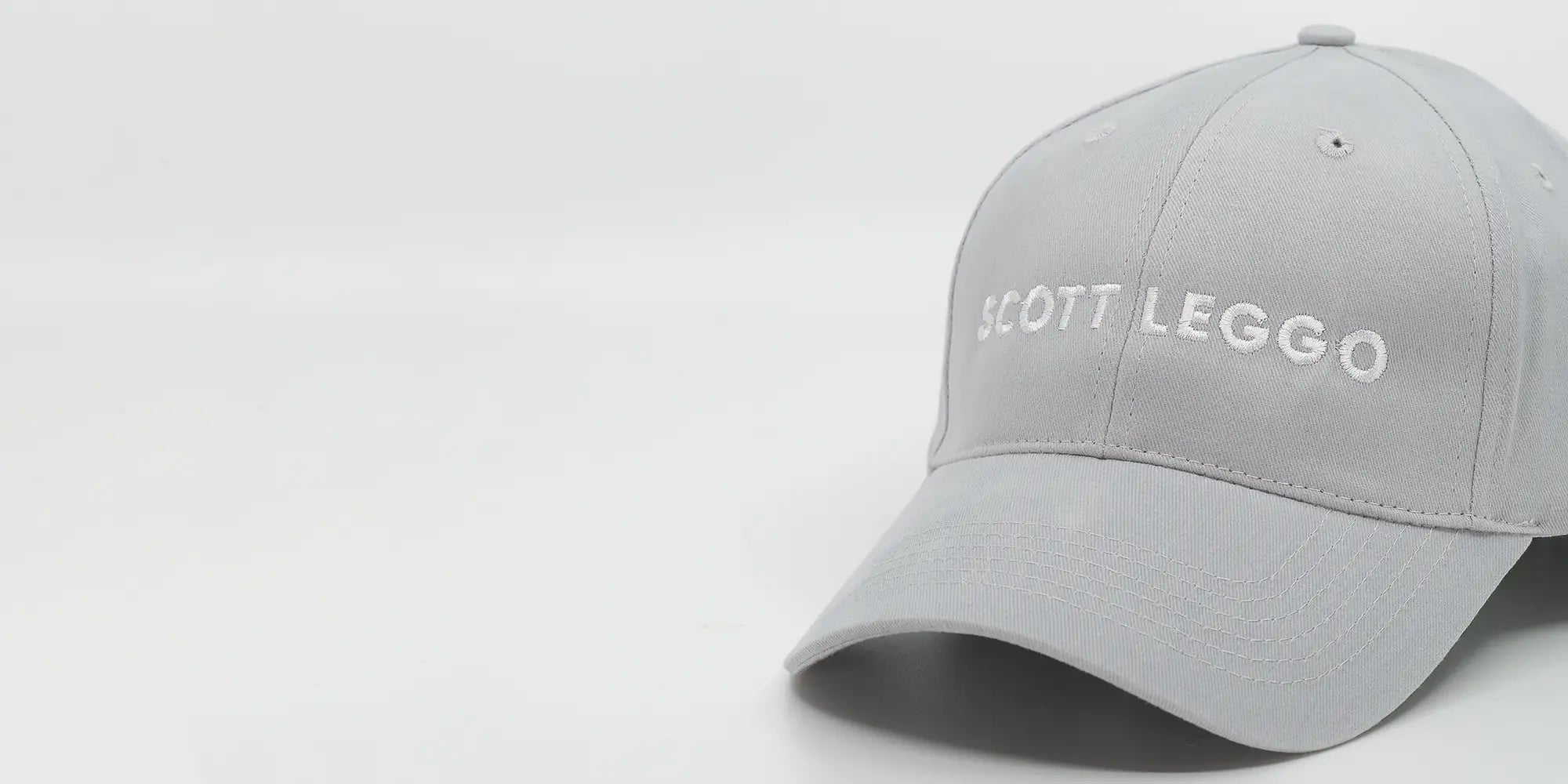 Scott Leggo baseball cap in alpine grey colour with logo on front.