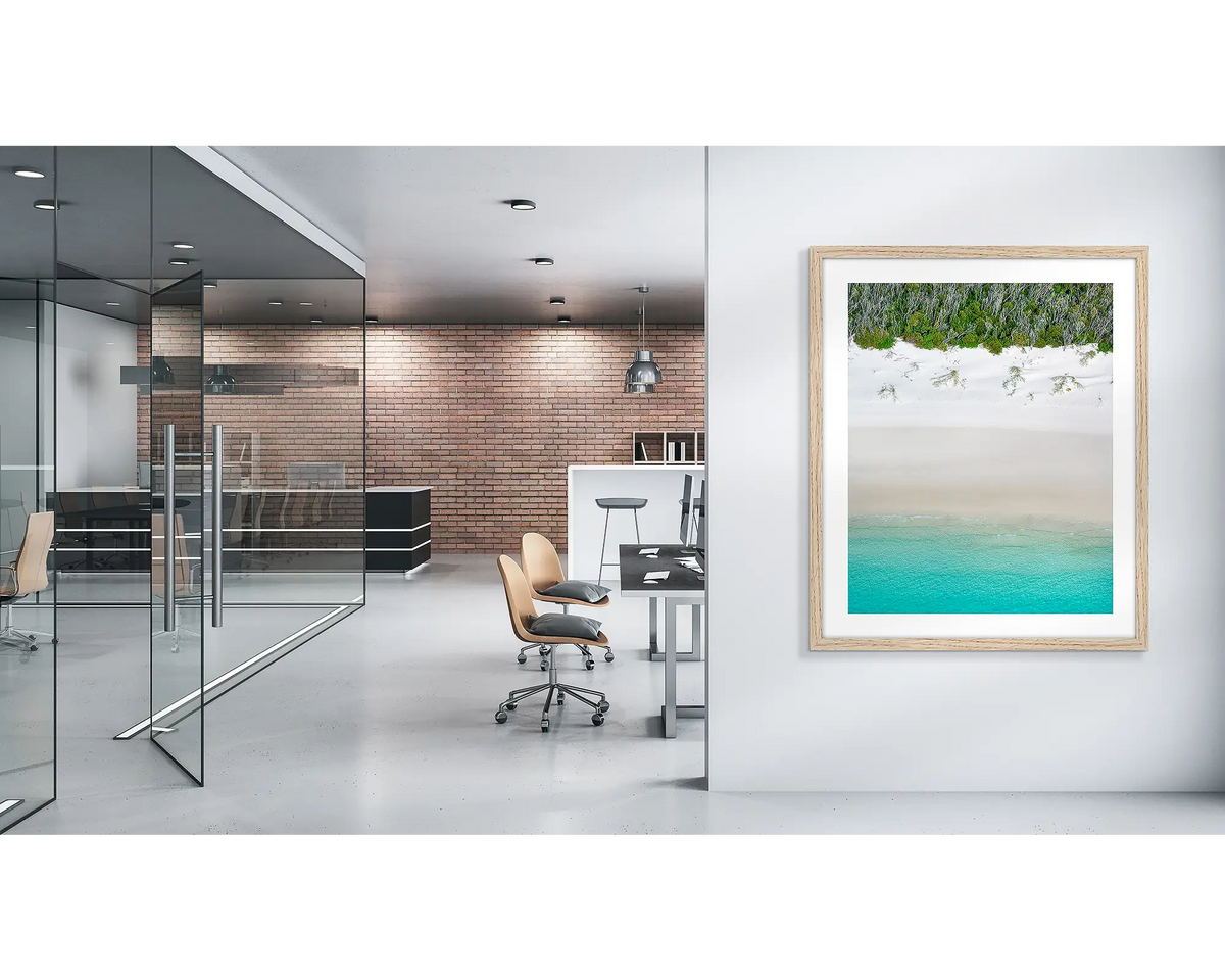 Sea Change. Whitehaven beach wall art print with a timber frame, in a modern office. 