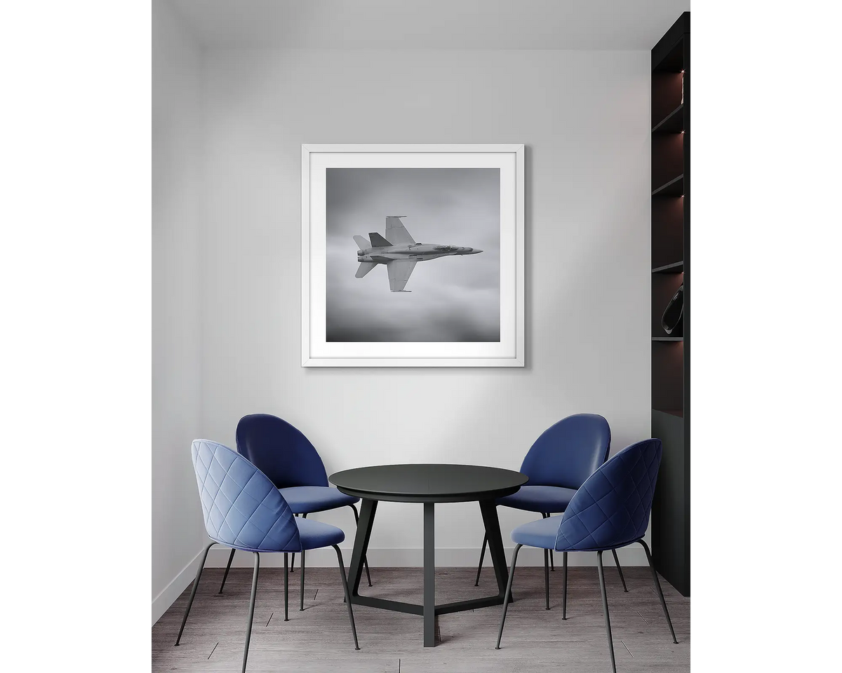 seek and Strike. F-18 Hornet aviation wall art print, with a white frame, in an office meeting room. 