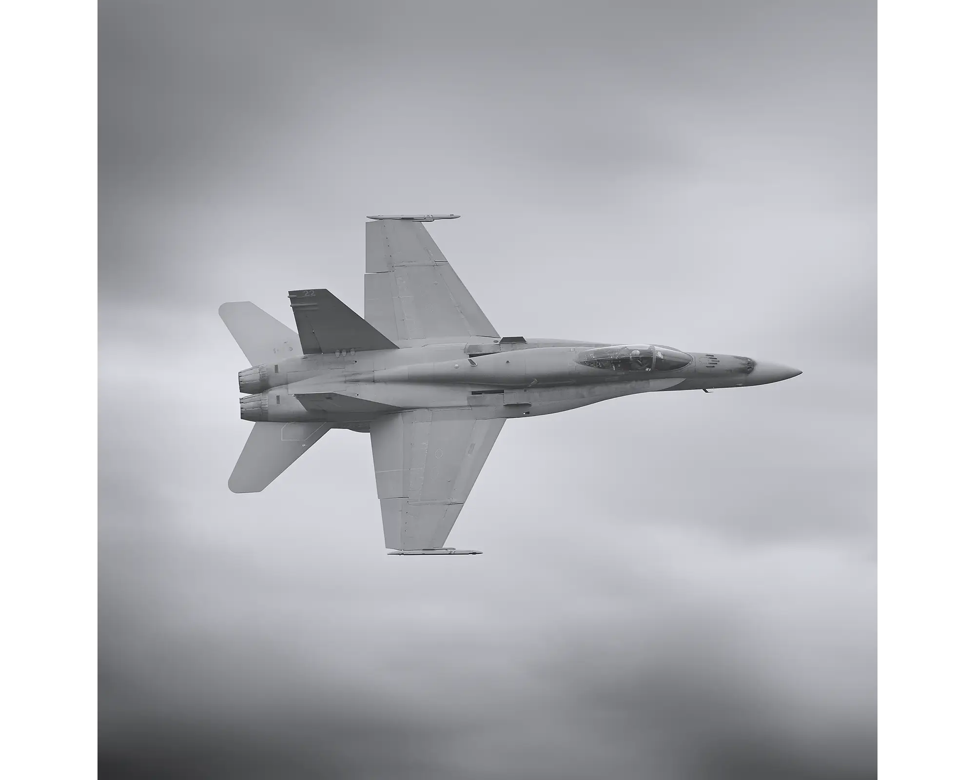 Royal Australian Air Force F/A-18 Hornet, 75 squadron, flying through clouds. 