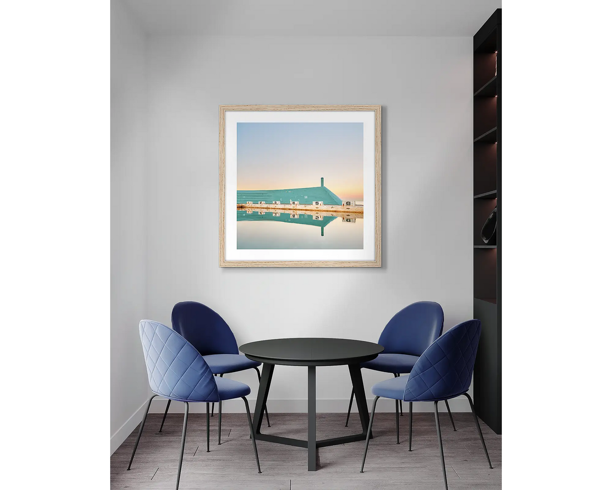 Six. Newcastle Baths wall art print, with a timber frame, in an office meeting room. 