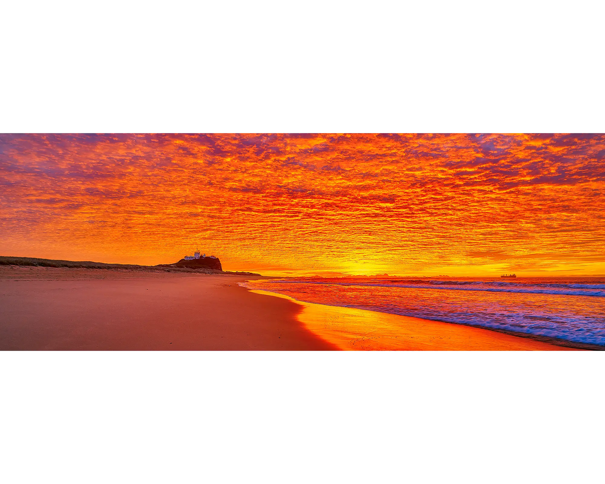 Orange and red sky at sunrise, Nobbys Beach, Newcastle, NSW. 