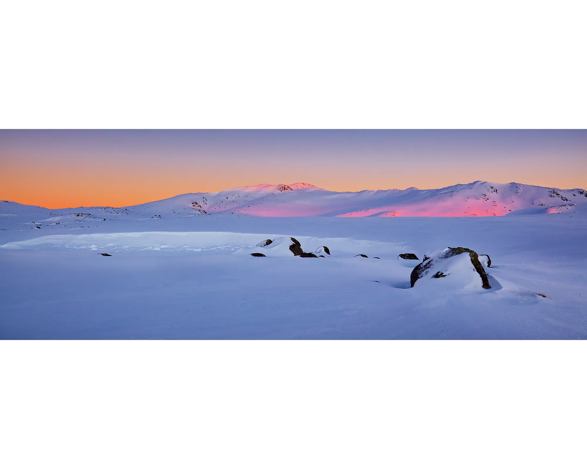 Sunrise over the Snowy River covered in snow, Kosciuszko National Park, NSW. 