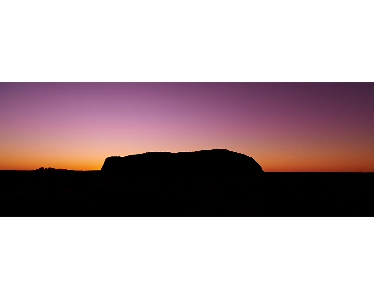 Purple and orange sky over Uluru and Kata-Tjuta at sunset, NT.