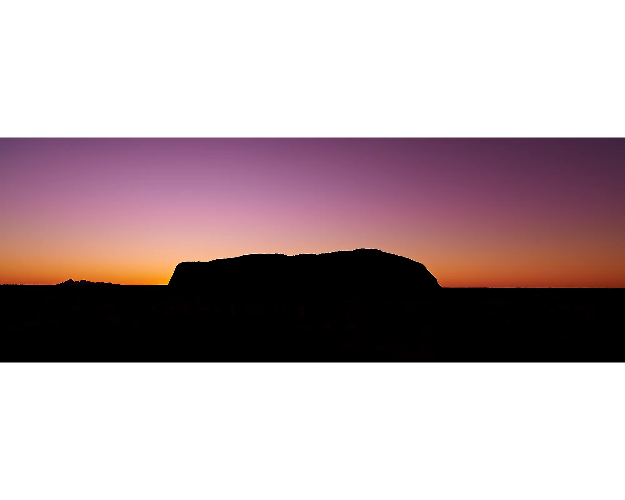 Purple and orange sky over Uluru and Kata-Tjuta at sunset, NT.