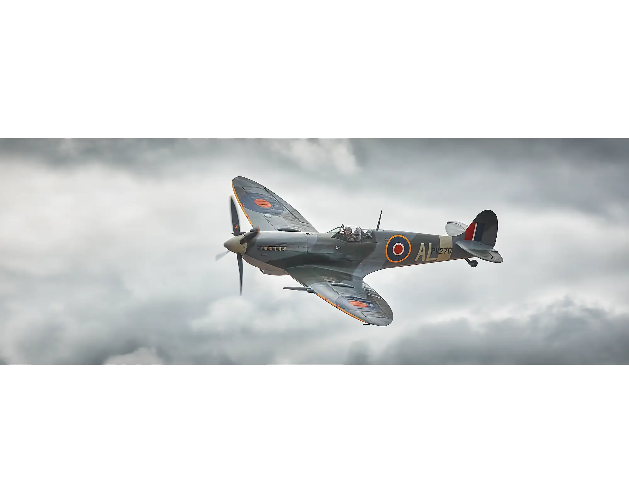 Vickers Supermarine Mk IXc PV270 Spitfire flying through clouds. 