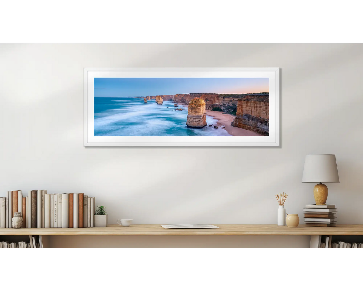 Standing Strong. Twelve Apostles panoramic wall art print, with a white frame, in a home office.