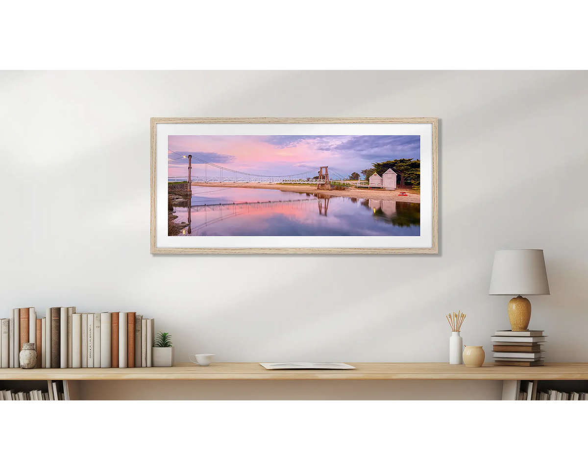 Swing Bridge. Lorne wall art print, with a timber frame, hung above a small office shelf. 