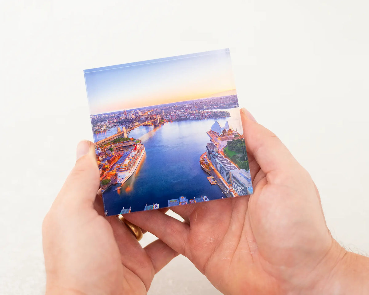 Sydney Awakes 10cm acrylic block being held.