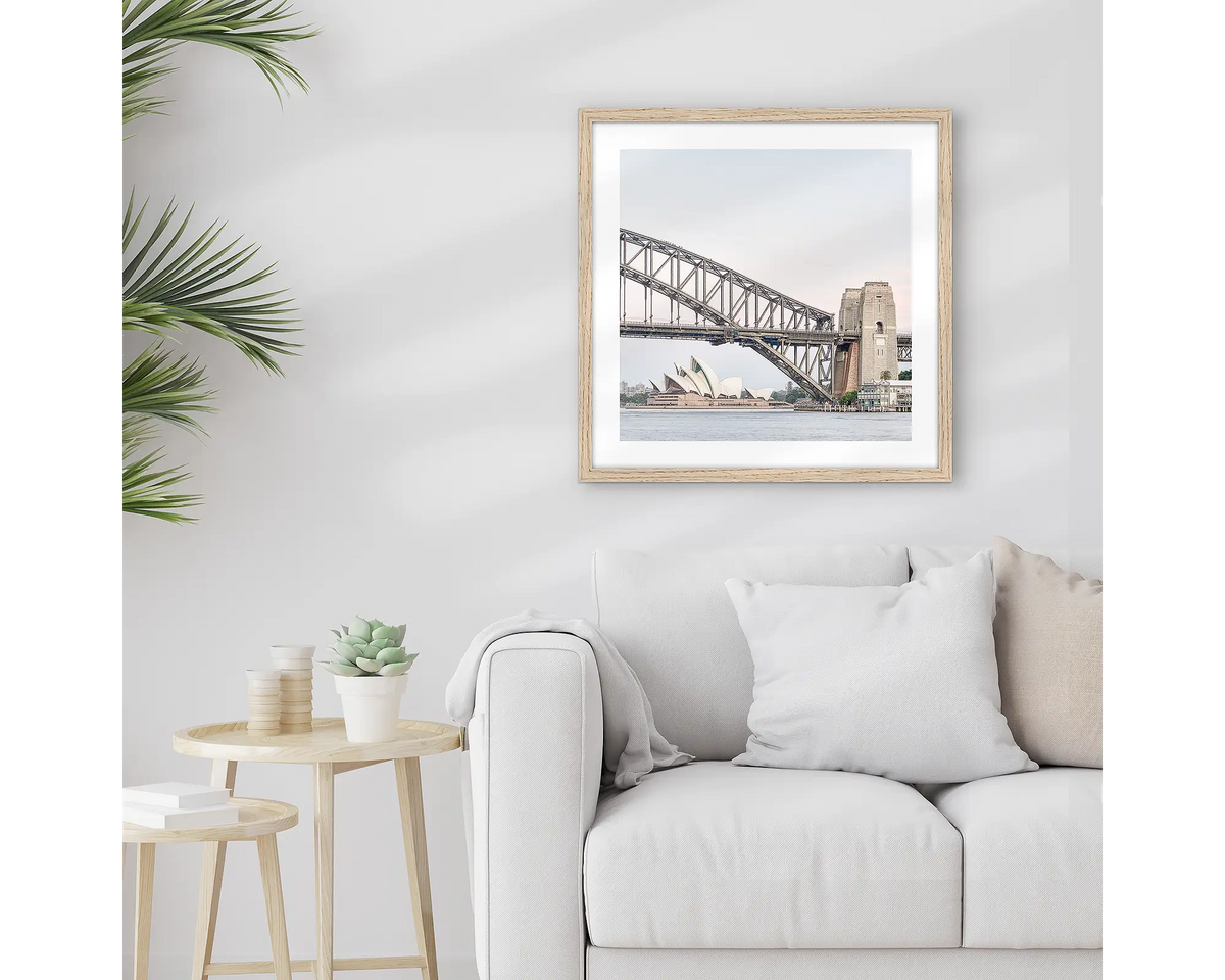 Sydney Icons. Sydney wall art print, with a timber frame, hung above a couch.